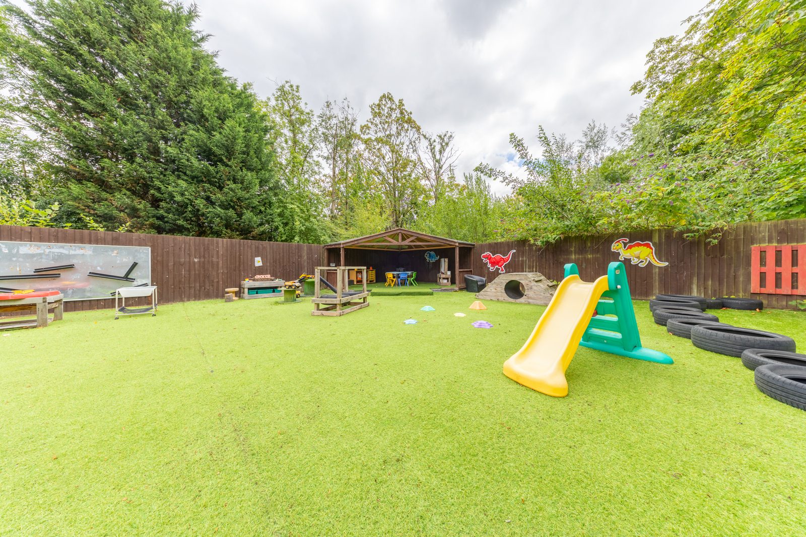 Our garden, with the slide and climbing logs